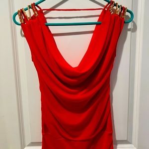 Never used, but tag removed. Looks red in the pictures but it is dark orange.